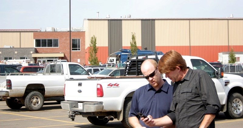 Fort McMurray-Athabasca MP Brian Jean (r) and Athabasca-Redwater MLA Jeff Johnson at the Regional Multiplex visiting Slave Lake evacuees last Saturday.