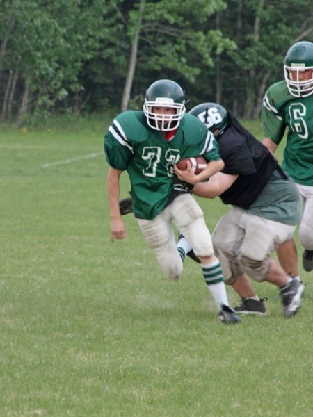 The Edwin Parr Composite Pacers football team wrapped up their spring camp with an inter-squad scrimmage last Friday. Kolt Duperron (72) tries to break free of Jesse