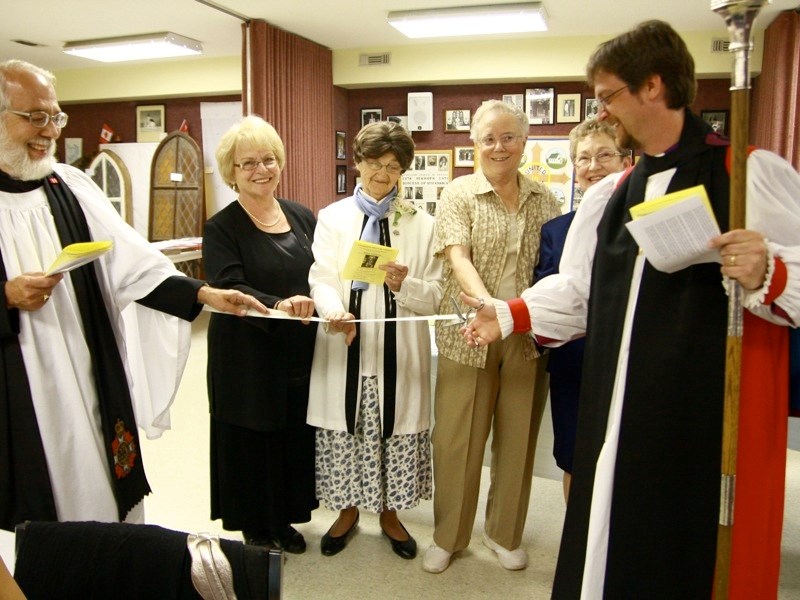 From left to right: Rev. Greg Lynn, Dolores Martynek, Mary Gisalson, Nancy Minns, Judy Edwards and Rt. Rev. Fraser Lawton, prepare to cut the ribbon, officially opening All