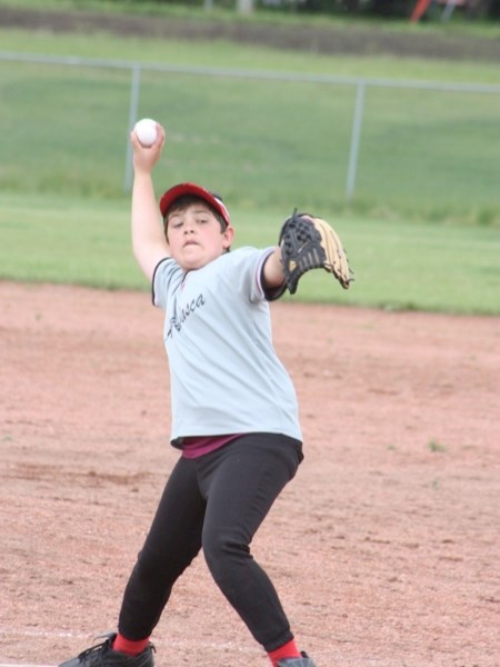 Abrean White of Athabasca&#8217;s Grey Trappers mosquito team goes into his wind-up during tournament action last Saturday.