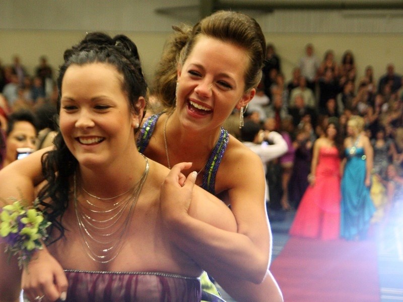 Graduates of three local high schools took their first step towards the future on Saturday. EPC&#8217;s Amy Kobzey (l) and Chelsea Lindballe enter in style.