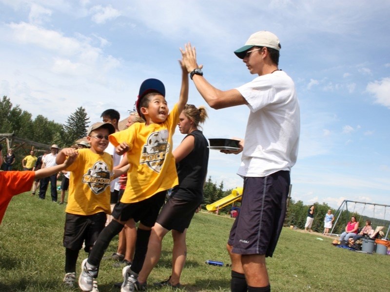 Over 70 local kids took part in the Athletes In Action soccer camp at Landing Trail Intermediate School in Athabasca last week. Eric Geng jumps to give &#8216;Coach