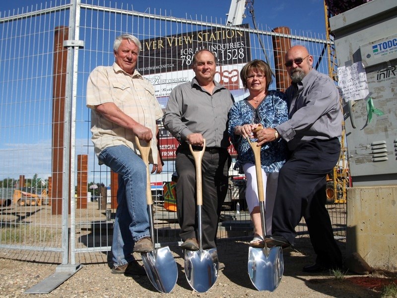 (l-r) River View Station project manager Bruce Tuininga, Mayor Roger Morrill, and husband and wife joint venture partners Donna and Bill Gallinger break ground, symbolizing