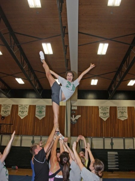 Kistin Supernault of the Edwin Parr Composite senior high cheerleading team displays her athleticism during practice last week. The team practices two to three times a week