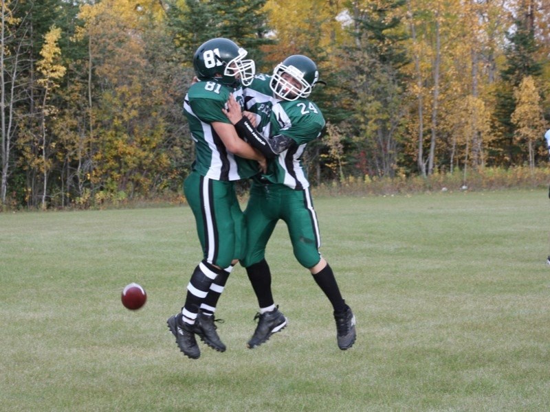 Braden Anderson (81) and Mitchell Snow celebrate a touchdown during the Athabasca Pacers 33-8 triumph over Vegreville at Edwin Parr Composite on Friday.