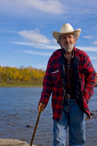 Roland Woodward, a member of the Fort McMurray First Nation and environmental activist for Keepers of the Athabasca Watershed Council, stands in front of the Athabasca River. 