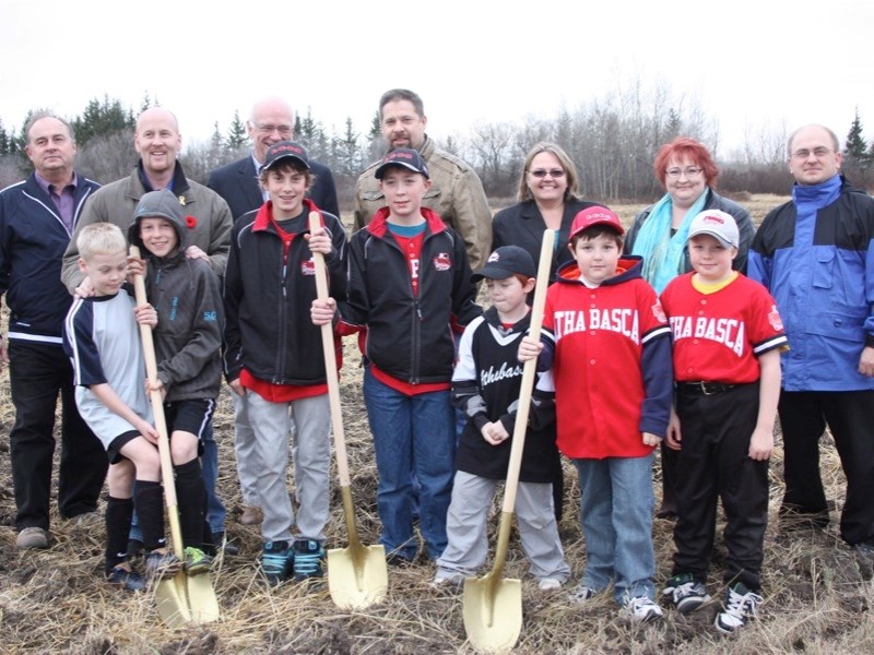 The shovels are in the ground for the sports park project at the Athabasca Regional Multiplex. (top row, l-r) Athabasca Mayor Roger Morrill, MLA Jeff Johnson, AU president