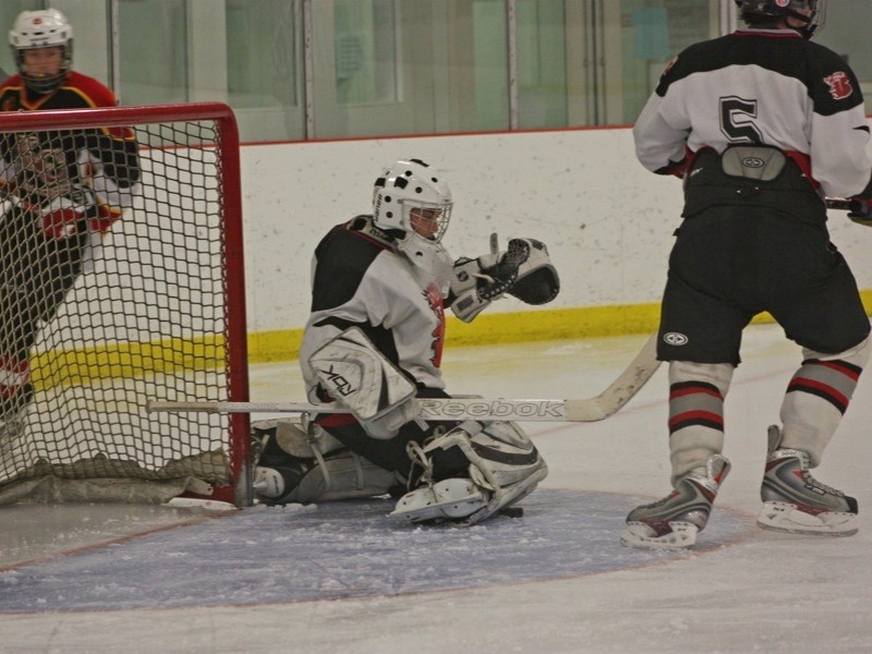 The Boyle Blazers bantam team won their annual hockey tournament last weekend by winning all four games they played. Goaltender Mason Gauthier keeps the puck safe under his