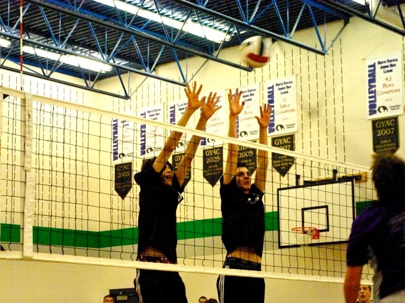 The Edwin Parr Composite Predators senior boys volleyball team won silver at a tournament in Edson Nov. 4-5. Tate DeCoine and Keagan Richardson put up a large block.