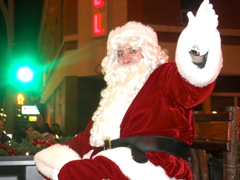 Santa Claus waves to the crowd during last year&#8217;s Midnight Madness parade.