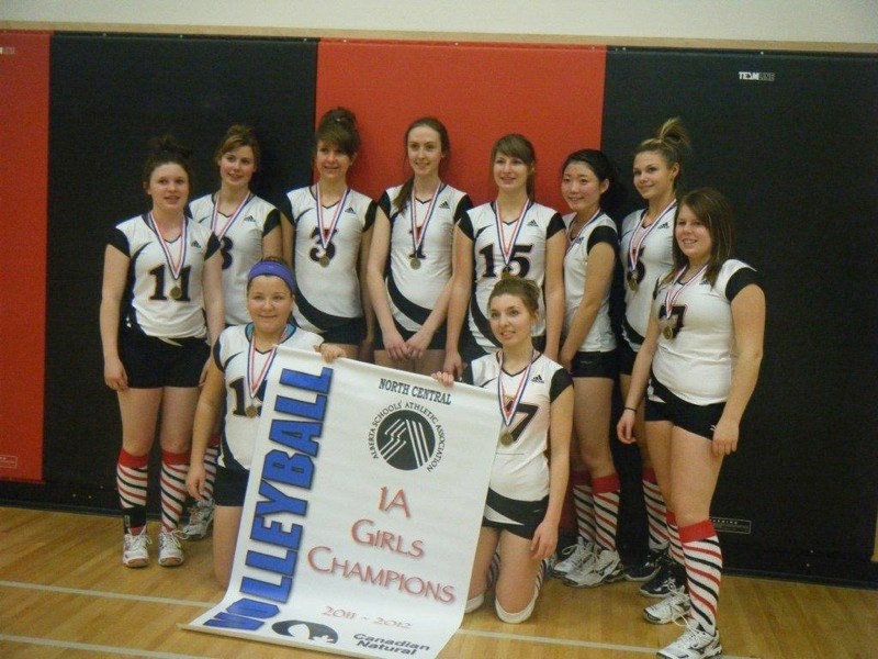 The girls pose with their hard won zone championship banner.