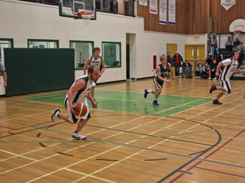 Jeremy Major of the EPC senior boys basketball team heads up the court during a game against Barrhead last week.