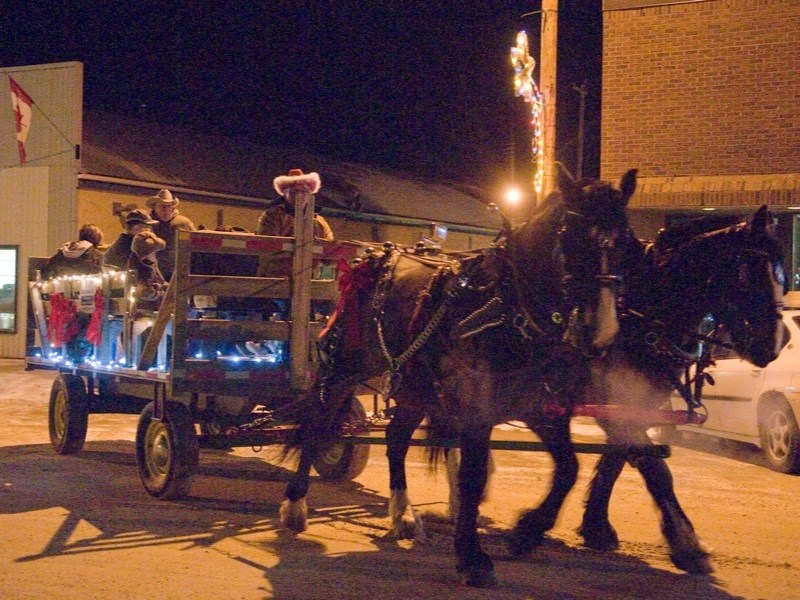 Willard Wolansky and his horses Jake and Major take Boyle shoppers on a delightful sleigh ride through the streets during the village&#8217;s first annual Moonlight Madness
