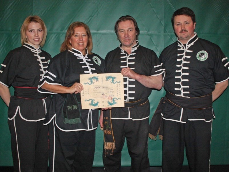 Green Dragon Kung Fu&#8217;s Karen Ramstead was recently honoured with her first degree black belt. (l-r) Simou Valeri Haines, Ramstead, Sifu Jostein Haugland and Sifu Kevin