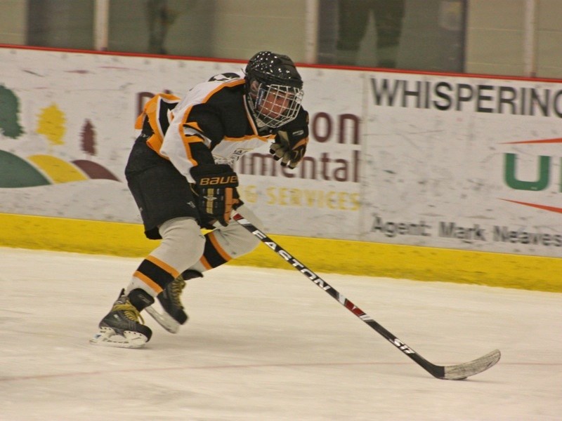 The Athabasca Midget &#8216;A&#8217; Hawks opened the floodgates for 12 goals in a romp over the Slave Lake Thunder at the Multiplex last Friday. Marc Terrien races up the
