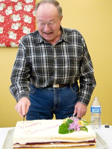 Pleasant Valley Lodge resident Alex Krawec cuts the anniversary cake at the Lodge&#8217;s celebration last week.