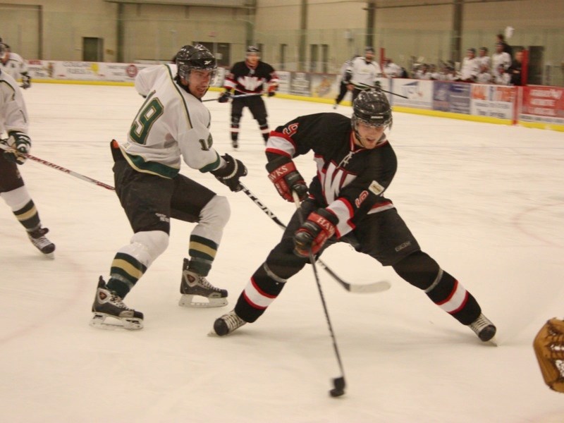 Chris Hopper (19) of the Athabasca Aces chases Shawn Proulx of the Slave Lake Winterhawks during game action at the Multiplex last Friday. The Aces lost the game 4-3.