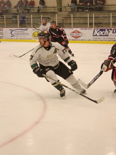 Brett Topola of the Athabasca Aces follows the puck during game one of the team&#8217;s opening round playoff series with the Legal Vipers last Saturday. The Aces won the