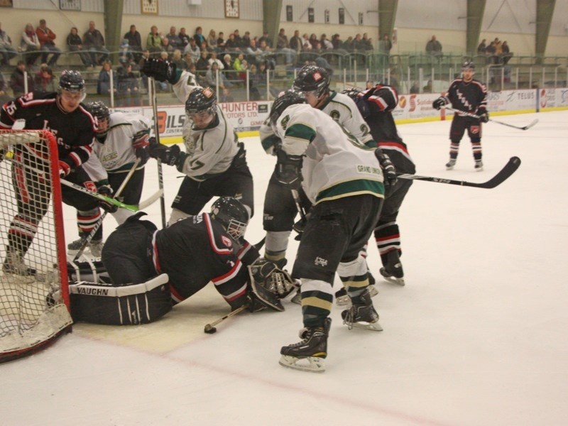 The Athabasca Aces were eliminated from the NCHL playoffs after a 6-1 loss to Legal on Sunday. (l-r) Brett Topola (17), James Smyth (9) and team captain Jody Tangedal (21)