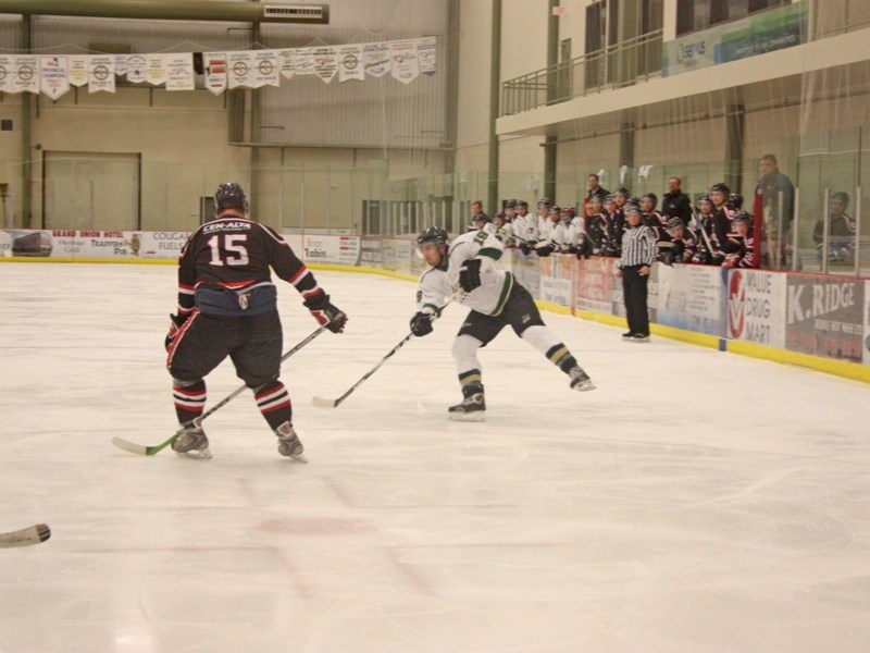 Chris Hopper of the Athabasca Aces fires the puck during the team&#8217;s last game of the season on Feb. 12.