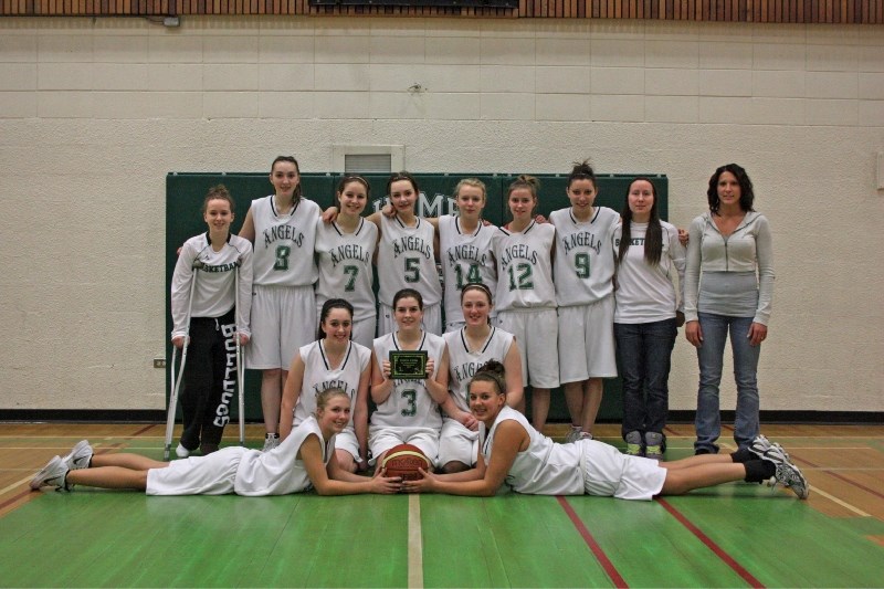 Edwin Parr Composite&#8217;s JV girls basketball team won all four of their games at their host tournament last weekend. The team shows off their championship plaque. (back