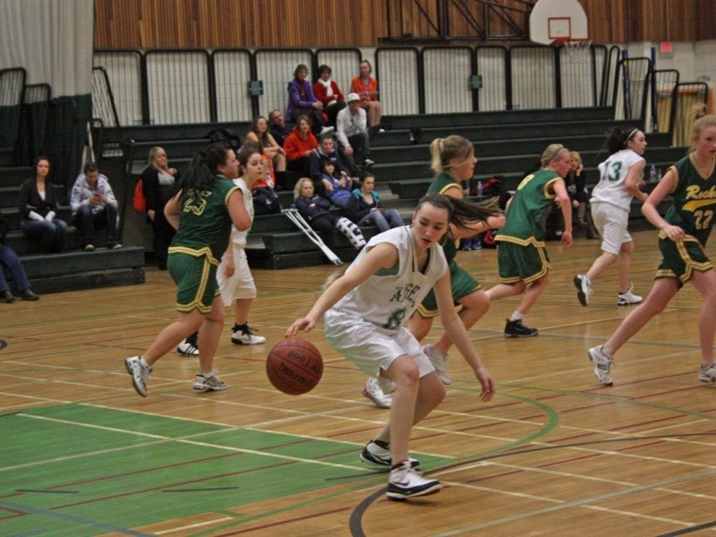 Lorina Ball of the EPC JV girls basketball team collects the ball during the zone championships last weekend. The EPC girls hosted the event and came out on top to win their