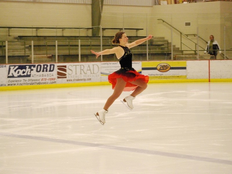 Megan Jackson leaps into the air during her performance at the Athabasca Figure Skating Club&#8217;s annual carnival at the Multiplex on Sunday.