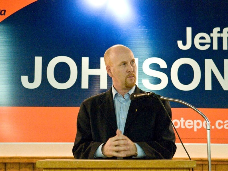Local MLA and Minister of Infrastructure Jeff Johnson listens to a question from a resident at the Athabasca Agriplex last Friday night.