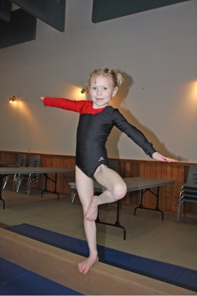 Local gymnasts showed off their amazing athleticism at the Athabasca FLIPS Fun Meet at the Agriplex last Saturday. Quinn Dubie keeps her balance with a stork stand on the
