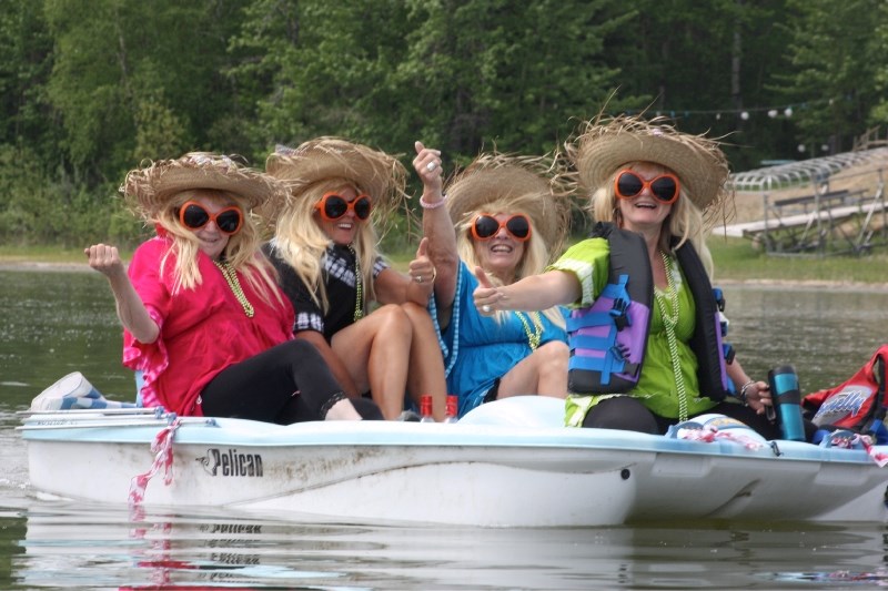 There was lots of fun to be had during the Battle of the Paddle on Saturday. (l-r) Claire Freeman, Linda Cunningham, Marlene Fizer and Terry Mudryk try to hitch a ride.