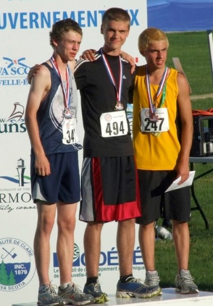 Thomas Weber (centre) of Athabasca won gold at the 2012 Acadian Games in Nova Scotia earlier this summer. He is flanked by the two runner-ups, Austin Roberts (left) and