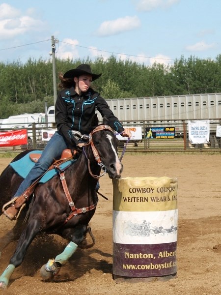 Lorina Ball and her horse Fancy, pictured at a recent competition, are a formidable team at gymkhana and rodeo events.