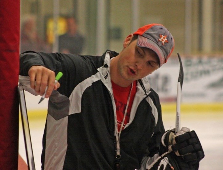 The Athabasca Aces are on the ice for training camp. Head coach Curtis Creaser draws up a play.