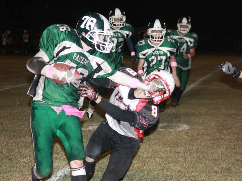 Cole Hamilton (76) of the Athabasca Pacers whips by a member of the R.F. Staples Thunderbirds during the Pacers big win last Friday.