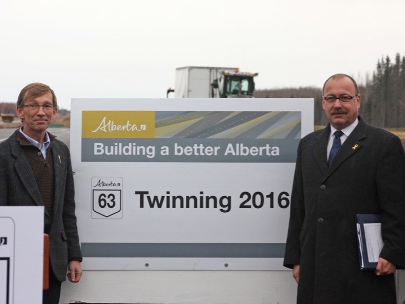 North of Wandering River last Friday, Alberta&#8217;s Transportation Minister Ric McIver (right) announced a 2016 completion date for the twinning of Highway 63 from