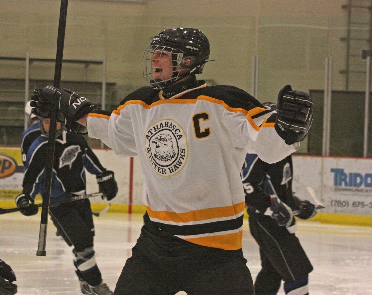 Midget Hawks captain Sam Davis celebrates scoring one of his four goals against Slave Lake last Friday.