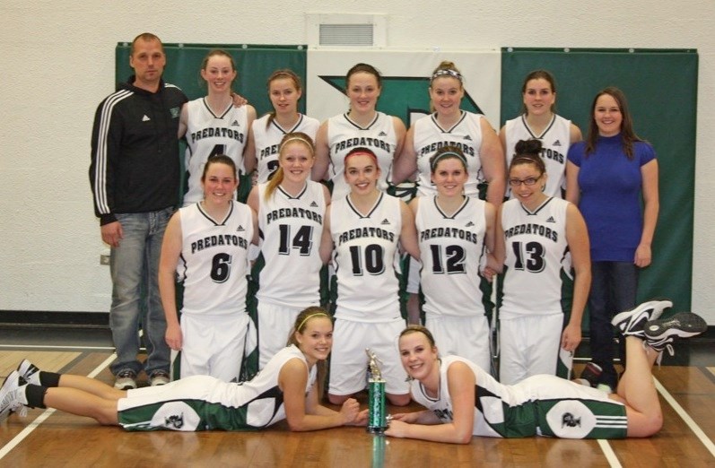 EPC&#8217;s senior girls basketball team won their host tournament last weekend. The girls celebrate with their trophy. (top row, l-r) coach Wade Hicks, Genevieve Annand,