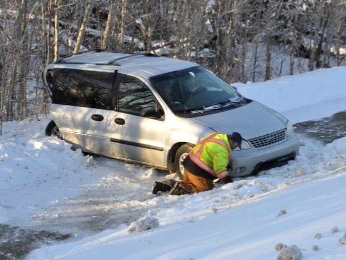 Highway 55 in Athabasca was a dangerous road last week with emergency services being called to accidents on Tuesday and Wednesday. A worker prepares to tow a vehicle that had 