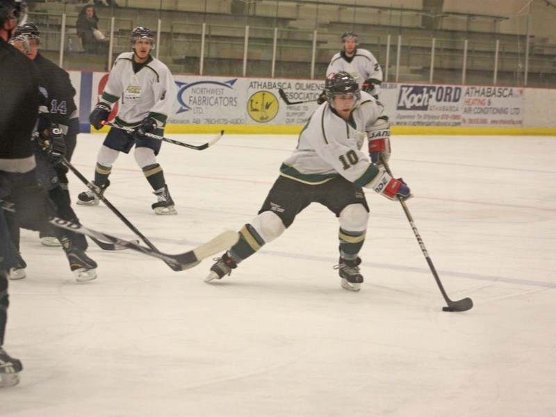 Aaron Grey handles the puck during game action.