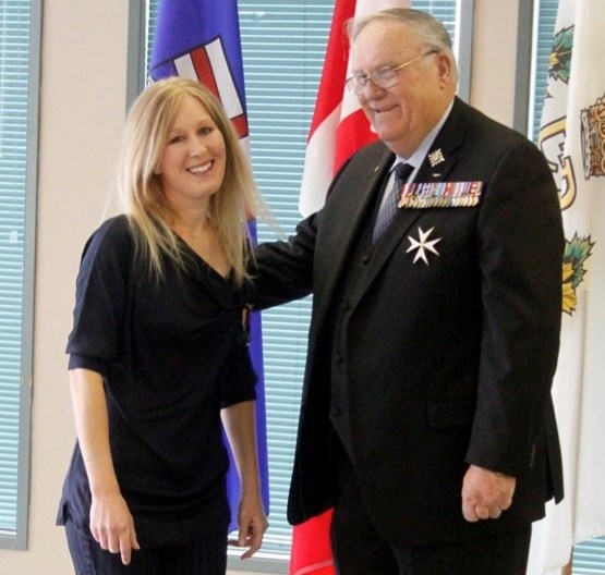 Two locals received Diamond Jubilee medals last week. Sylvia Christiansen, president and co-founder of Second Chance Animal Rescue Society near Athabasca receives medals from 