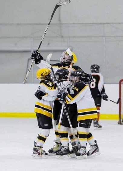 Local hockey teams competed at provincial championships on the weekend. Athabasca&#8217;s Peewee Hawks celebrate a goal.