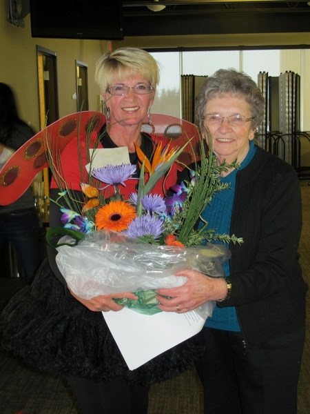 A long time member and key contributor of the Athabasca Curling Club, Olga Pacholok was recognized at the annual Ladies Bonspiel last month. She was presented with a floral