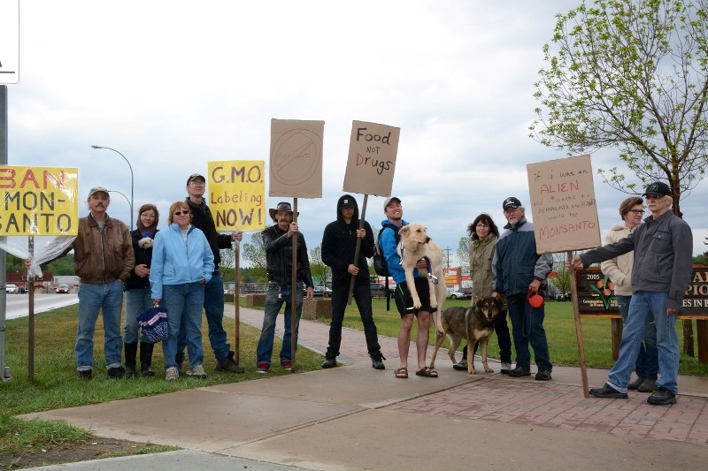 Protesters against the practices of agricultural biotechnology company Monsanto were out at the Athabasca Riverfront May 25, rallying support and raising awareness of what