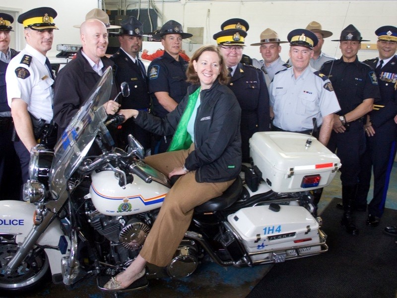 Member of the Legislative Assembly for Athabasca-Redwater-Sturgeon and Minister of Education Jeff Johnson poses for a photo op with Alberta Premier Alison Redford during the