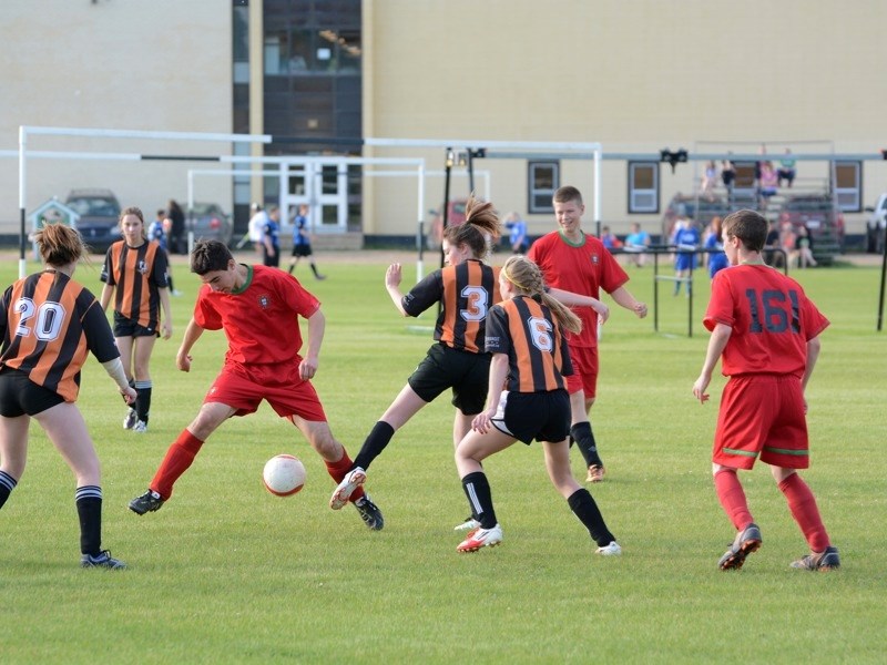 The Athabasca Saints U16 boys shut out the Morinville U18 mixed last Thursday. Mitchell Lovelace, son of head coach Terry Lovelace, weaves through three Morinville girls on