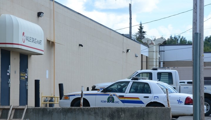 Police vehicles surround Athabasca Value Drug Mart Wednesday afternoon