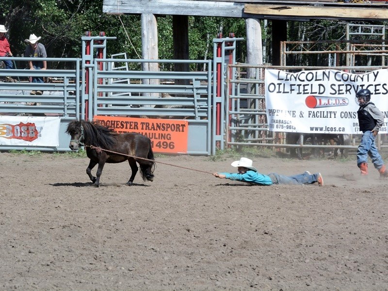 The Rocky Ridge Stampede drew hundreds of spectators and competitors last weekend. Jake Duncan of Athabasca doesn&#8217;t give up in the wild pony race Saturday.