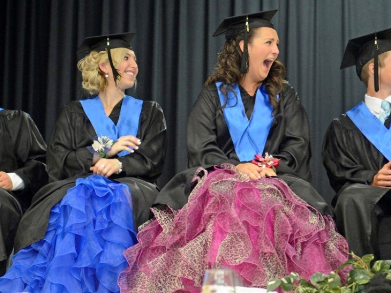 (l-r) Tristan Tymo and Marissa Matoga laugh at principal Marty Leach&#8217;s speech. He brought out a bunch of Post-it notes three of the students once left in his office