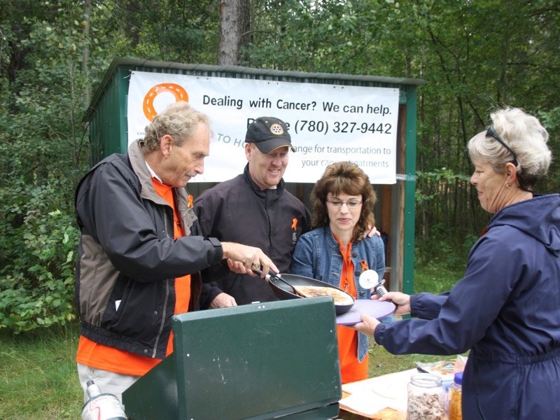 (l –r) Bill Deweert, Athabasca-Sturgeon-Redwater MLA Jeff Johnson, Nanci Pawluk and Caroline Pidzarko enjoy a bite at the seventh hole at last year&#8217;s Road to Hope Golf