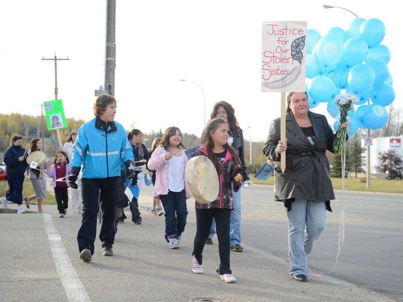 During this year&#8217;s Sisters in Spirit Vigil and Walk last Friday, Robin Baker carried balloons to the riverfront, where they were released into the sky. Her daughter,